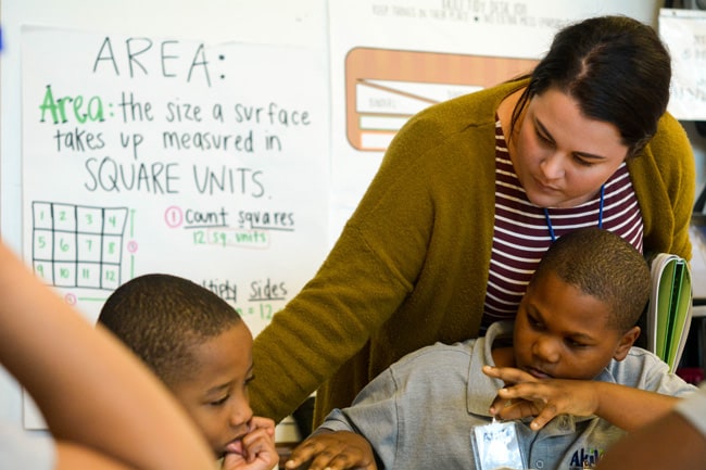 Relay teacher working with students