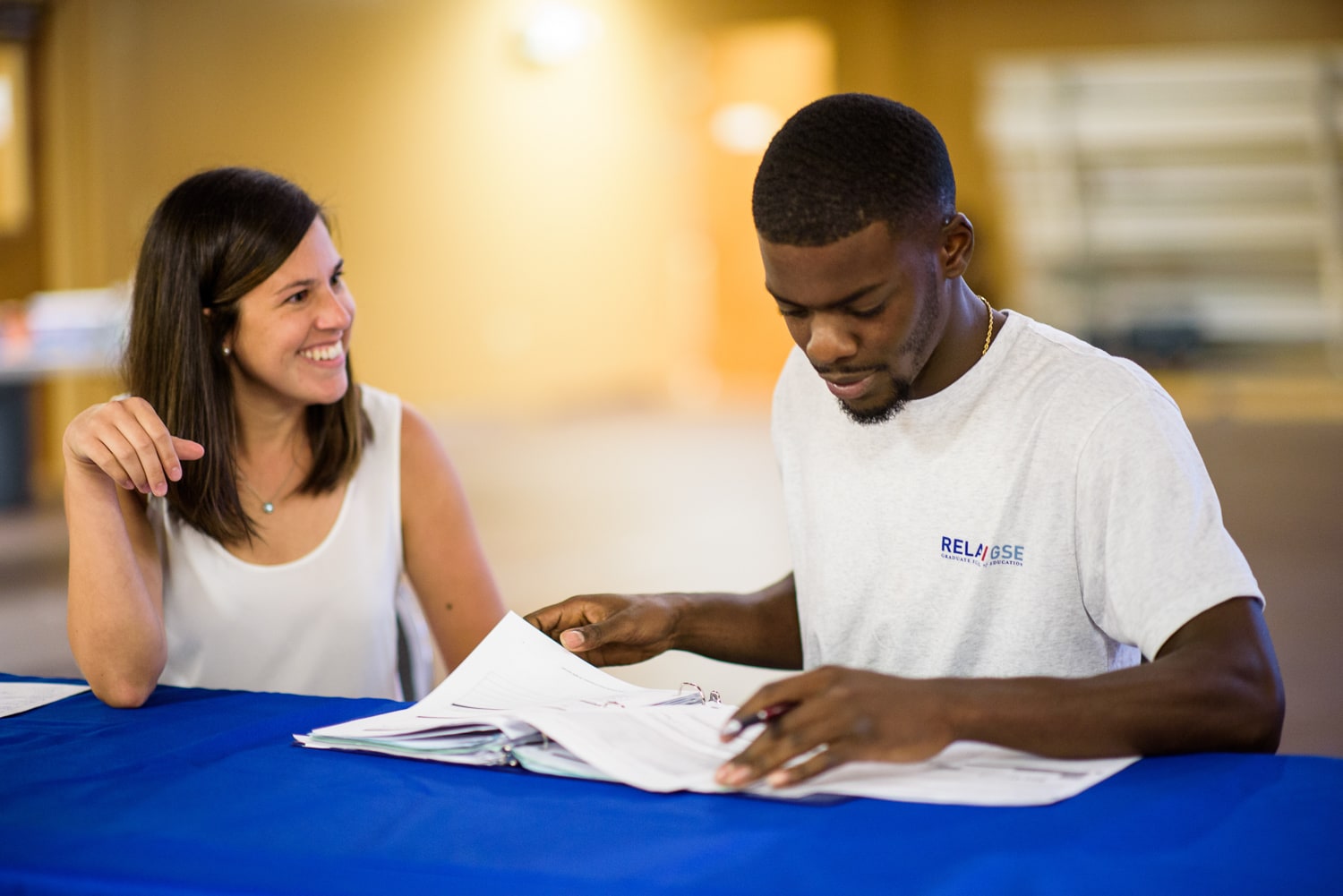 Professional education participant working with teacher.