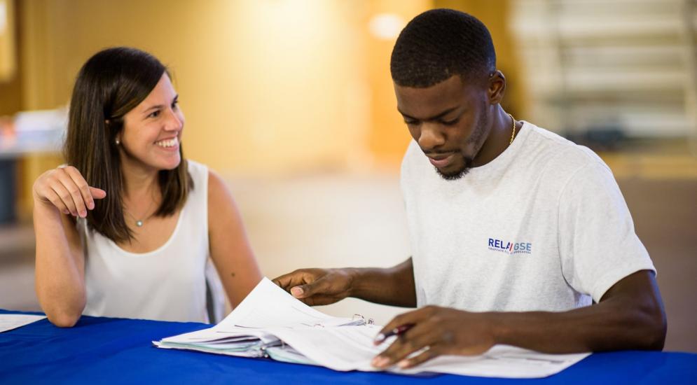 Professional education participant working with teacher.