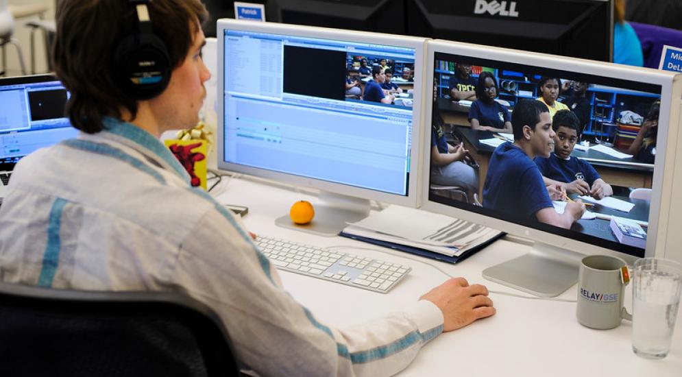 Relay employee working at computer